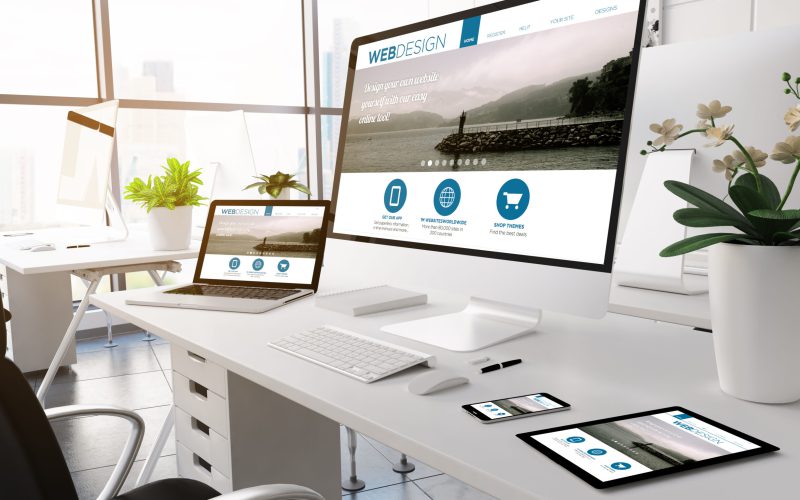3d rendering devices on modern office. web designwebsite on screen.